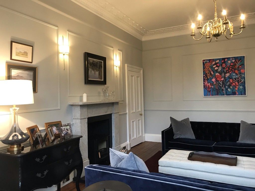 French-style wall panelling complements the beautiful Haresfield 3 seater sofa in Portland Velvet Navy with contrast piping in Portland Velvet Steel