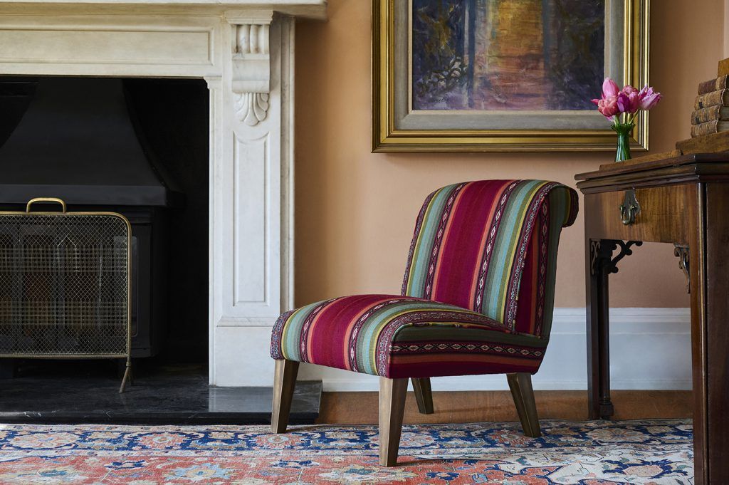 Occasional accent chair in handwoven Peruvian textile.