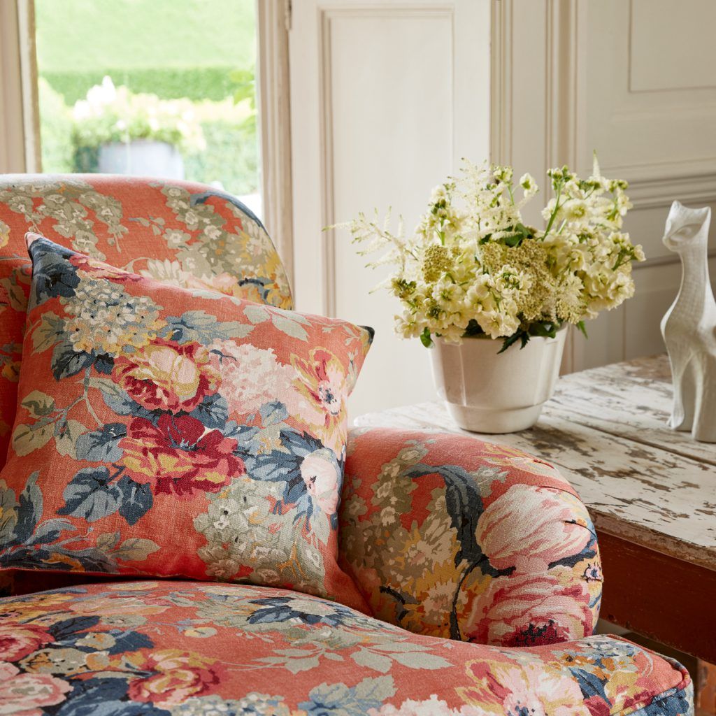 Coral orange rose floral patterned sofa