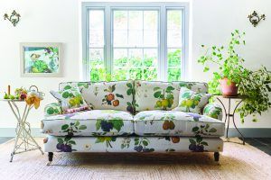 RHS 22 Fabric Collection William Hooker fabric with botanical fruit illustration design on classic English sofa