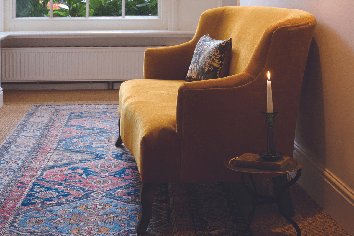 Two seater sofa in Honey velvet with autumn candle