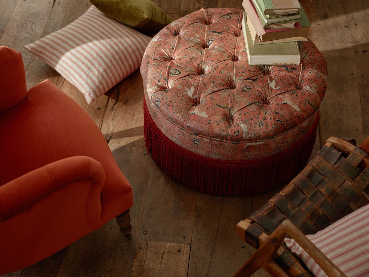 Buttoned footstool in printed velvet design Lahore Dynasty from Sofas & Stuff's V&A Threads of India Opulent Velvets collection